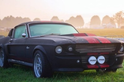 Iconic Muscle Cars and a Beloved Classic Van: A Glimpse into Automotive History